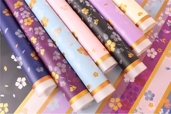 Wrapping Paper packing printed  glossy flowers with a material solid color above the edge
