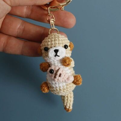 Buy Knitting Amigurumi Cute Plush Otter Holding Fish Keychain Oyuncak Crochet Animal Toys Doll Soft Crocheted Otter Keychains online manufacture