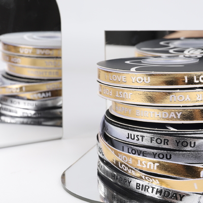 Good price 1cm hot stamping English letter small gold bar floral tie gift cake ribbon DIY material gift box decorative tape online