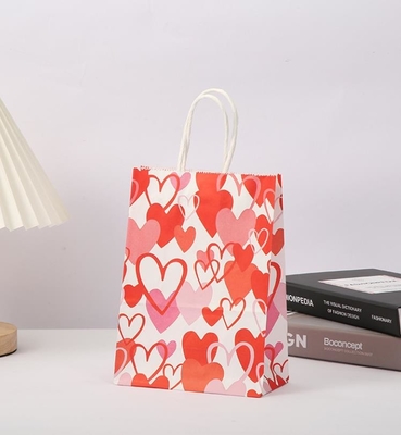 Good price Red 80gsm Kraft Paper Gift Bags Love Heart Printed Paper Goodie Bags With Handles online